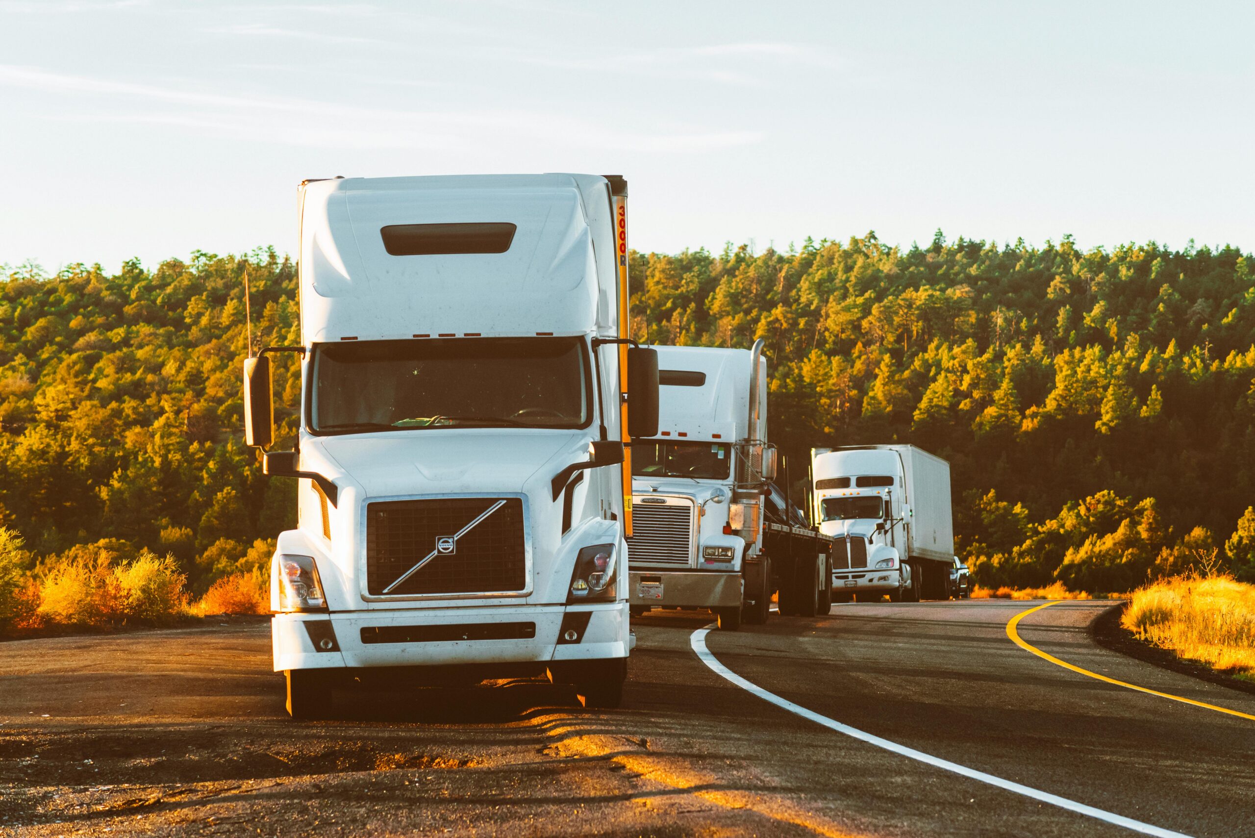 pexels-quintingellar-2199293 (2) Semi trucks off road at sunset